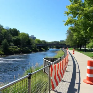 Construction barriers on Saluda Riverwalk with greenery in the background