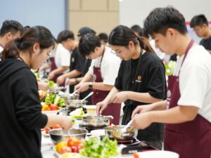 Young chefs collaborating in a cooking summit in Chapin